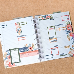 May include: A weekly planner with floral designs and colorful stickers. The planner has a tab labeled "January" and another tab labeled "Weekends". The planner has a section for each day of the week, with space for writing appointments and tasks. The planner also has a section for notes and a section for goals. The planner is open to the week of January 26th, 2024. The planner has a sticker that says "Today's Chores" and another sticker that says "NOW!"