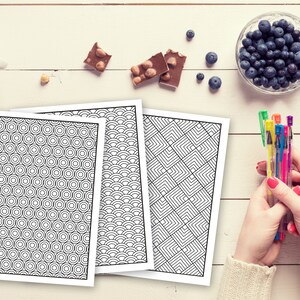 May include: Three black and white printable coloring pages with geometric patterns. The patterns include concentric circles, overlapping arcs, and squares.