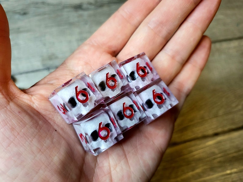 d6 dice set with white skull inside and red numbers