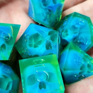 Dnd dice set with blue skull inside and neon green resin
