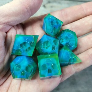 Dnd dice set with blue skull inside and neon green resin