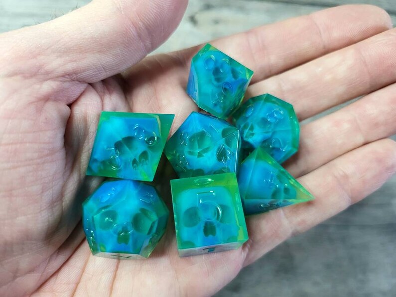 Dnd dice set with blue skull inside and neon green resin