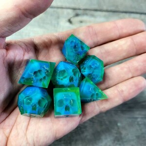 Dnd dice set with blue skull inside and neon green resin