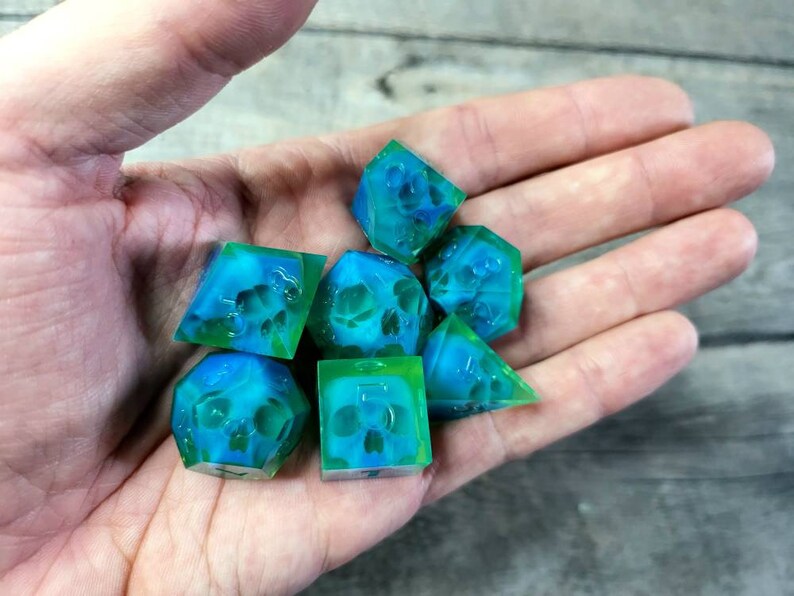 Dnd dice set with blue skull inside and neon green resin