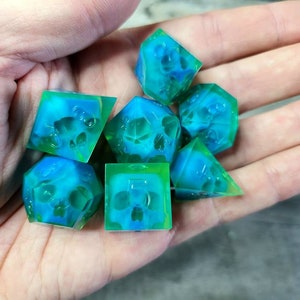Dnd dice set with blue skull inside and neon green resin