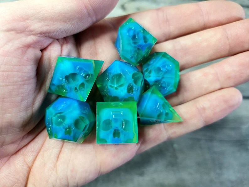 Dnd dice set with blue skull inside and neon green resin
