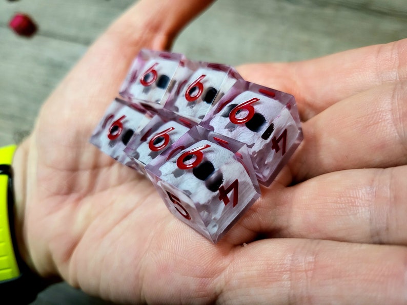 d6 dice set with white skull inside and red numbers