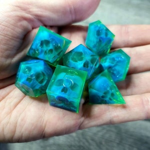 Dnd dice set with blue skull inside and neon green resin