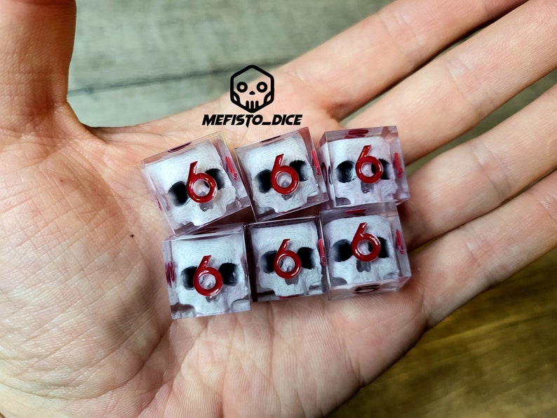 d6 dice set with white skull inside and red numbers