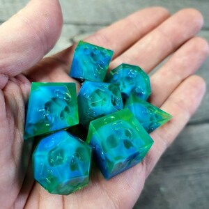 Dnd dice set with blue skull inside and neon green resin