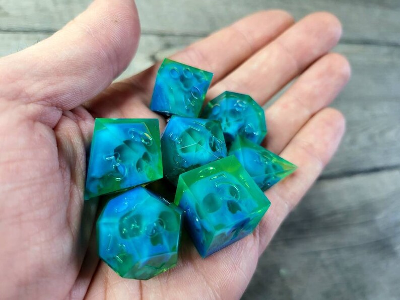 Dnd dice set with blue skull inside and neon green resin
