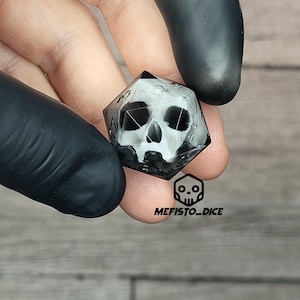 d20 dice for playing Dungeons and Dragons with a white skull inside and black resin