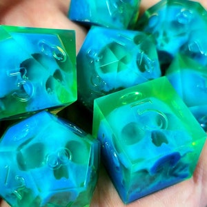 Dnd dice set with blue skull inside and neon green resin