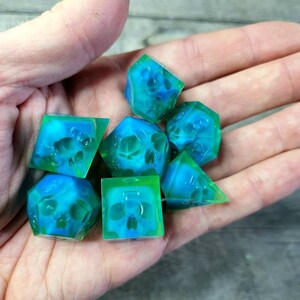Dnd dice set with blue skull inside and neon green resin