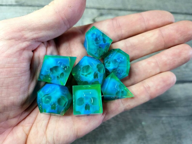 Dnd dice set with blue skull inside and neon green resin
