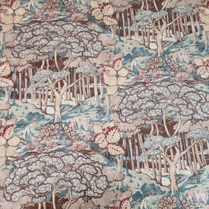 May include: A fabric with a repeating pattern of a forest scene. The design features trees with light gray foliage, brown trunks, and a backdrop of blue and tan hues. The fabric also includes red and pink floral accents.