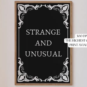 May include: Black and white printable art print with a decorative frame and the text "Strange and Unusual".