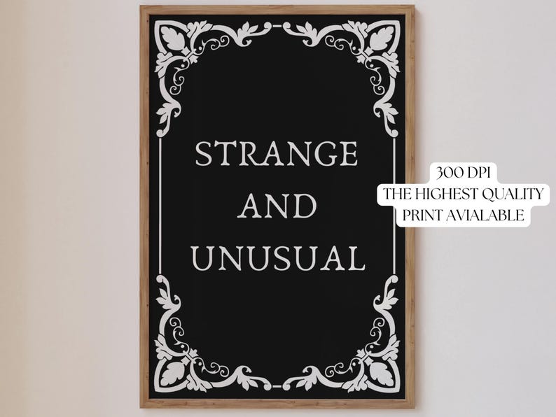 May include: Black and white printable art print with a decorative frame and the text "Strange and Unusual".
