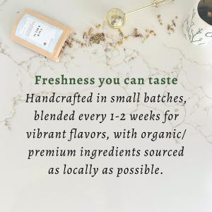 May include: A tan paper tea pouch labeled Calm & Relax, a gold metal tea infuser, and loose dried herbs. The text reads: Freshness you can taste. Handcrafted in small batches, blended every 1-2 weeks for vibrant flavors, with organic/premium ingredients.