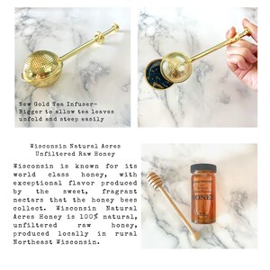 May include: A gold-colored metal tea infuser with a spherical mesh head and a long handle, alongside a glass jar of Wisconsin Natural Acres Unfiltered Raw Honey with a black lid and a wooden honey dipper, featuring text about the honey's origin.