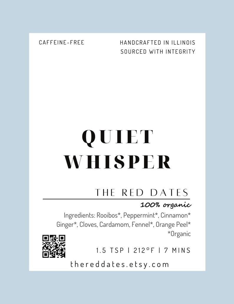 May include: A white rectangular tea label with black text reading Quiet Whisper, The Red Dates, 100% organic, and a list of ingredients including rooibos, peppermint, cinnamon, ginger, cloves, cardamom, fennel, and orange peel with a QR code.
