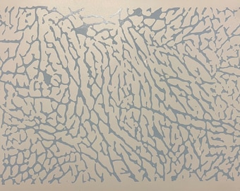 May include: A rectangular surface with a light beige background and a repeating pattern of light blue, vein-like shapes. The design resembles the texture of elephant skin or a topographical map.