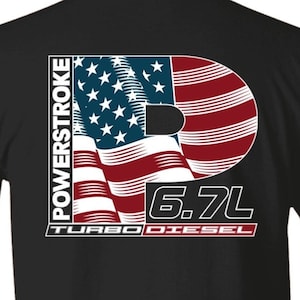 May include: Black t-shirt with a white and red American flag design. The flag is shaped like the letter "P" and has the text "POWERSTROKE 6.7L TURBO DIESEL" below it.