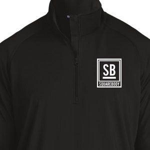 May include: Black long-sleeve athletic shirt with a white zipper and a white logo that says "SB SQUAREBODY" on the left chest.