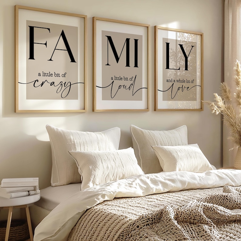 May include: Three framed prints spelling "FAMILY". Each print has a beige background with black text. The first reads "FA" and "a little bit of crazy". The second reads "MI" and "a little bit of loud". The third reads "LY" and "and a whole lot of love".