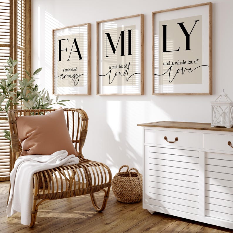A set of 3 prints with the word 'Family' in a large serif typeface in a bold black colour spread across the 3 pages - FA, MI and LY.
Underneath the letters are the quotes 'a little bit of crazy', 'a little bit of loud', 'and a whole lot of love', with the focal words 'crazy, loud and love' joined together with an elegant wavy black line stretching across to the edge of the pages.