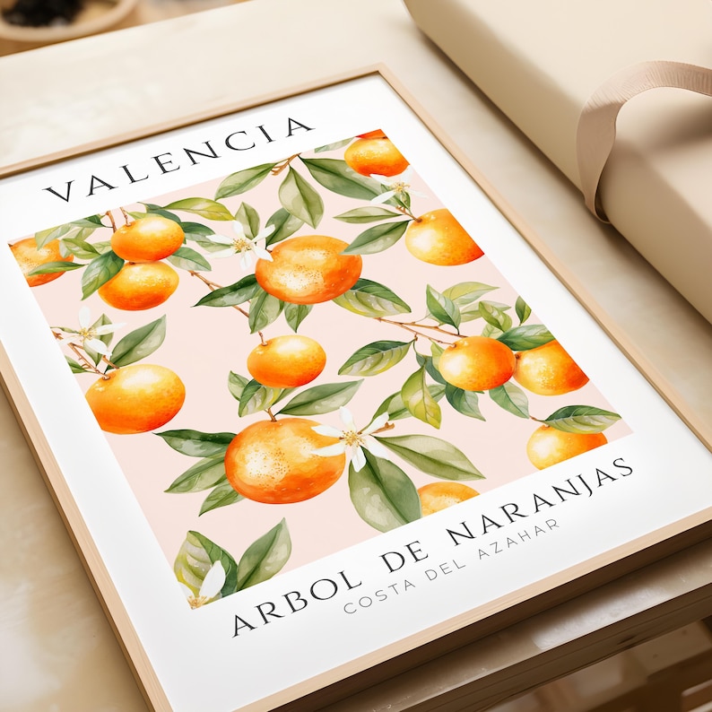 May include: A framed print with a watercolor illustration of orange trees with the text "Valencia, Arbol de Naranjas, Costa del Azahar" in black.