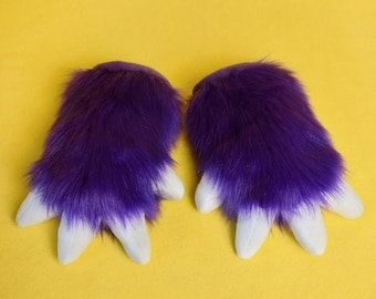 May include: A pair of purple furry hand paws with white claws. The paws are soft and fluffy, and they would be perfect for a costume or cosplay.