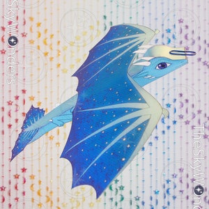 May include: A blue and white paper dragon with a glittery finish and a star pattern. The dragon is flying with its wings spread out. The background is a rainbow of colors with stars and crescent moons.