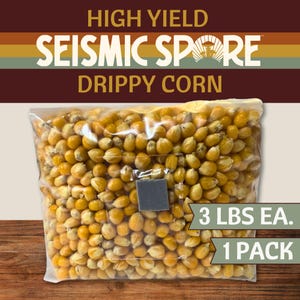 May include: A clear plastic bag filled with yellow popcorn kernels. The bag has a label with the text "HIGH YIELD SEISMIC SPORE DRIPPY CORN." The label also indicates "3 LBS EA. 1 PACK."