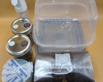 May include: A set of supplies for growing plants from seed, including a clear plastic container, two glass jars, a bag of soil, a spray bottle, a pack of parafilm, a scalpel, a surgical blade, and a digital thermometer.