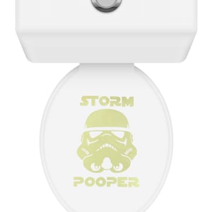 May include: White toilet seat with a yellow Stormtrooper graphic and the text "STORM POOPER".