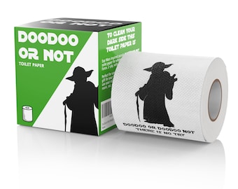 May include: A roll of white toilet paper with a green and black box. The toilet paper has a black silhouette of Yoda from Star Wars on it. The text on the toilet paper reads "DOODOO OR DOODOO NOT THERE IS NO TRY". The box has the text "DOODOO OR NOT TOILET PAPER" on it.