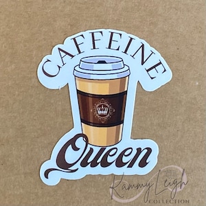 May include: White sticker with the text "Caffeine Queen" in brown lettering. A cartoon image of a coffee cup with a crown on the side is in the centre of the sticker.