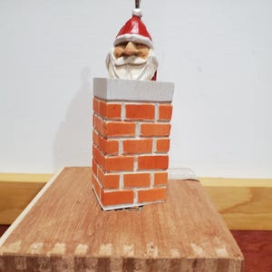 Santa in chimney Christmas ornament