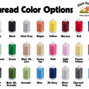 May include: A chart of thread colors for embroidery, with spools of thread in various colors, including white, black, steel grey, maple, yellow, maroon, red, bright navy, mint green, green, medium dark ecru, tawny tan, pink, light pink, pastel yellow, brown, forest green, medium dark avocado, avocado, blue, dark navy, silver grey, charcoal grey, and baby blue. The chart is titled "Thread Color Options" with the text "Plant Stitch made with love" in the top right corner.
