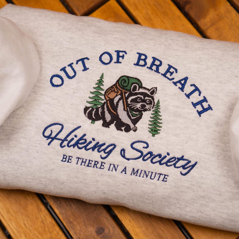 ✨Free Personalization✨Out of Breath Hiking Society Embroidered Sweatshirt, Personalized Funny Hiking Crewneck, Raccoon Trash Panda Shirt, Nature Lover Sweater
