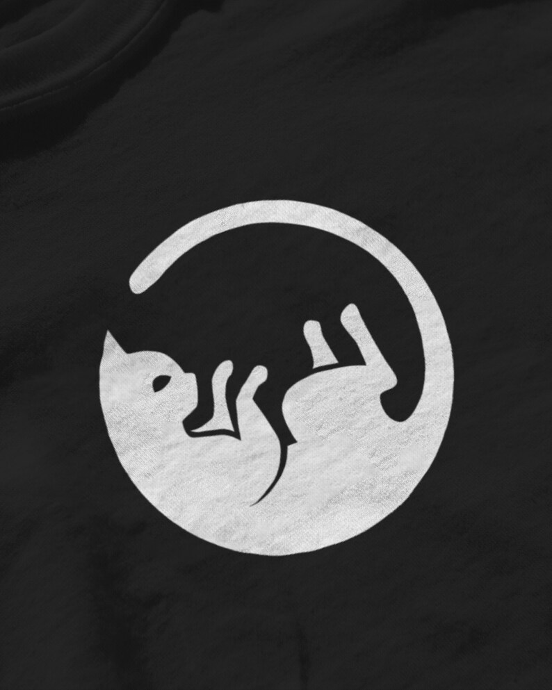 May include: A white silhouette of a cat curled up inside a circle, on a black background.