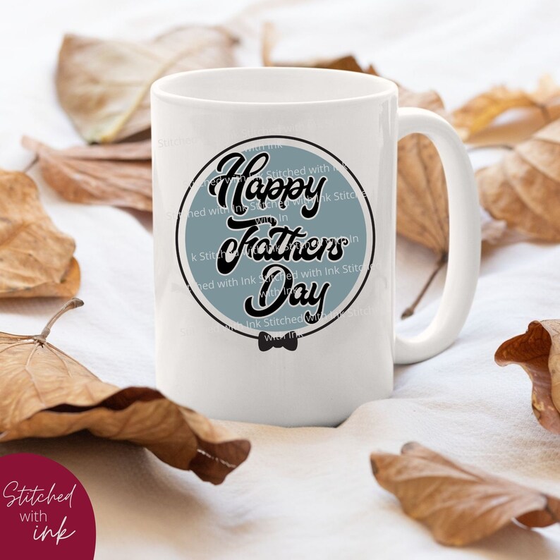 May include: White ceramic mug with a blue circle design that says "Happy Fathers Day" in black script. The circle has a black bow tie at the bottom.