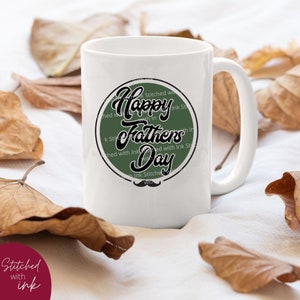 May include: White ceramic mug with a green circle design that says "Happy Fathers Day" in black script. The circle has a black stitched border and a black mustache at the bottom.