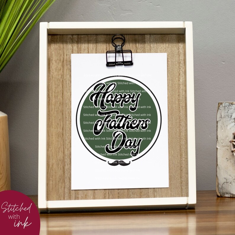 May include: A green circle with the text "Happy Fathers Day" in black script font. The circle is surrounded by the text "Stitched with Ink" repeated multiple times.