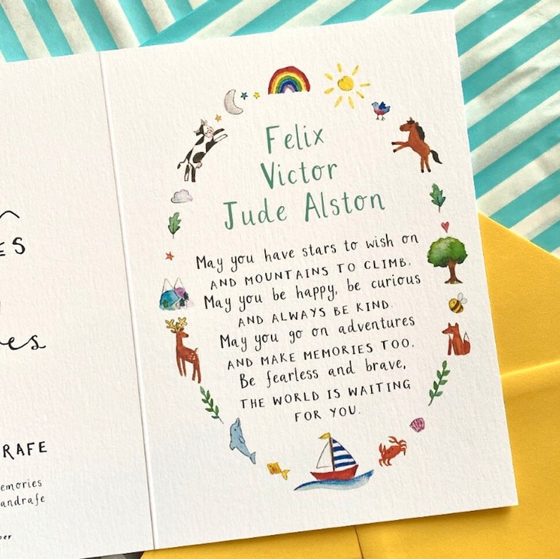 May include: A white card with a colourful illustration of animals and a rainbow. The card has a message that reads "May you have stars to wish on and mountains to climb. May you be happy, be curious and always be kind. May you go on adventures and make memories too. Be fearless and brave, the world is waiting for you." The card is personalised with the names "Felix Victor Jude Alston".