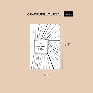 May include: A black and white gratitude journal with the text "I'm Grateful For..." in a box on the front cover. The journal is 5.8 inches by 8.3 inches.
