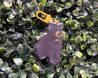 Llavero acrílico con diseño de oso negro y girasol