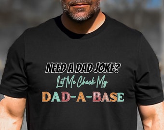 May include: A black t-shirt with a white graphic that says "NEED A DAD JOKE? Let Me Check My DAD-A-BASE".