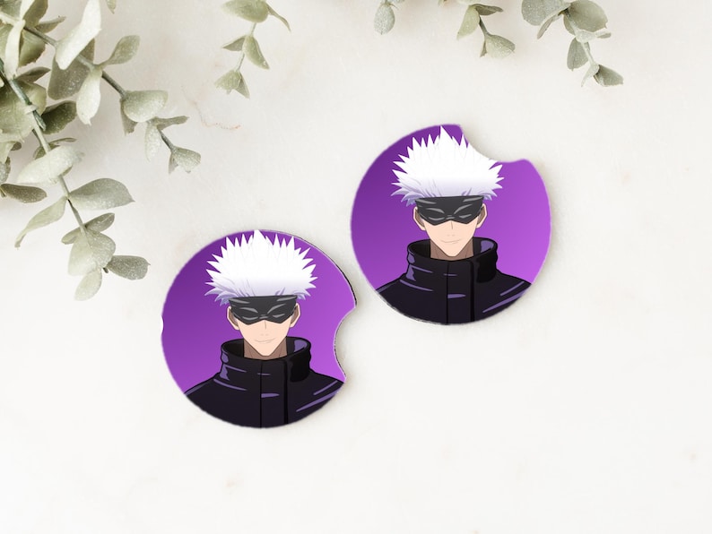 May include: Two purple round coasters with a white-haired anime character wearing a black mask and a black jacket. The character is on a purple background.